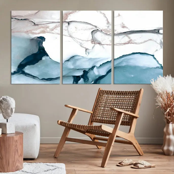 The modern living room features the Blue and Rose Gold Marble Fluid Effect Wall Art Abstract Canvas Art Print displayed on a gray wall.