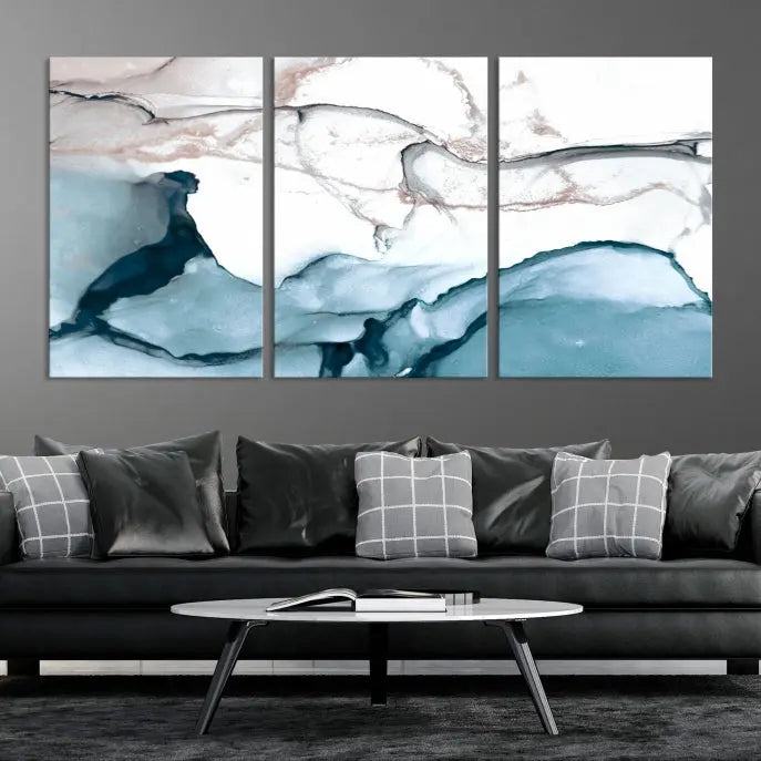 The modern living room features the Blue and Rose Gold Marble Fluid Effect Wall Art Abstract Canvas Art Print displayed on a gray wall.