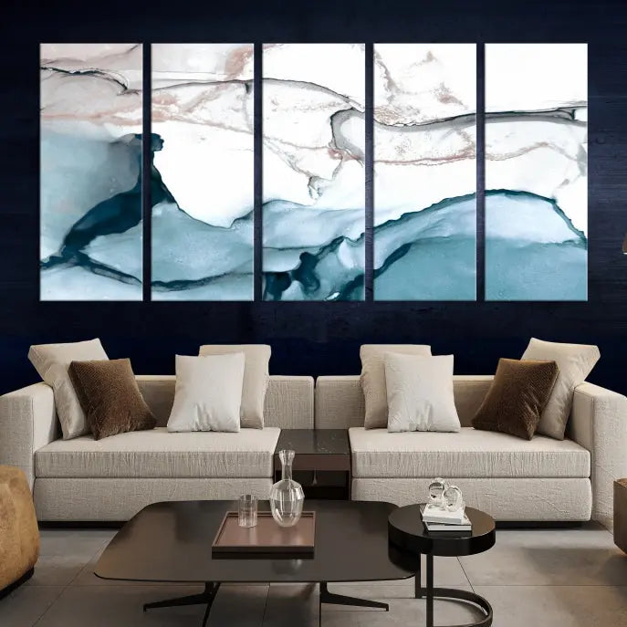 The modern living room features the Blue and Rose Gold Marble Fluid Effect Wall Art Abstract Canvas Art Print displayed on a gray wall.