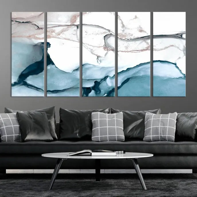 The modern living room features the Blue and Rose Gold Marble Fluid Effect Wall Art Abstract Canvas Art Print displayed on a gray wall.