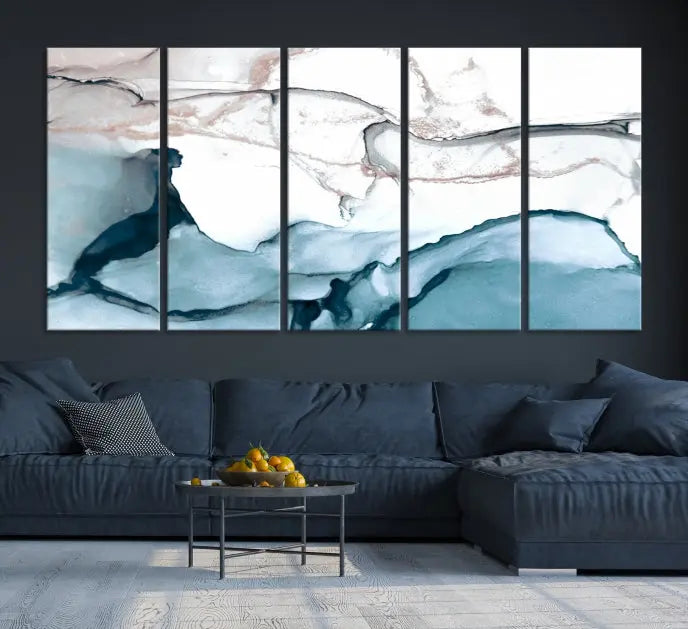 The modern living room features the Blue and Rose Gold Marble Fluid Effect Wall Art Abstract Canvas Art Print displayed on a gray wall.