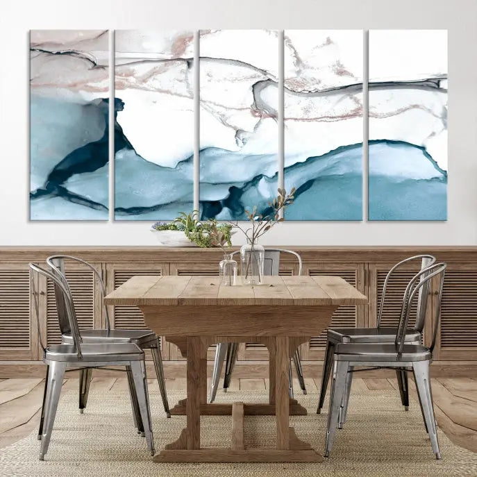 The modern living room features the Blue and Rose Gold Marble Fluid Effect Wall Art Abstract Canvas Art Print displayed on a gray wall.