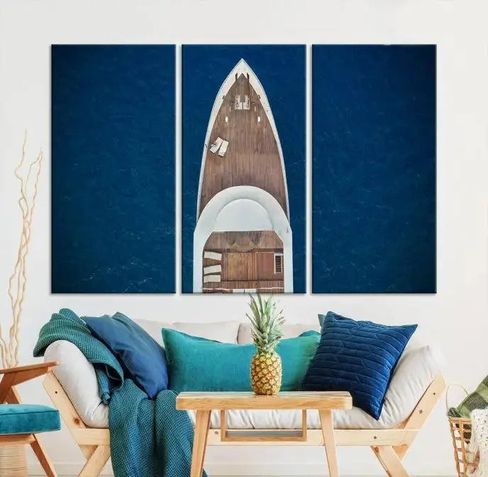 The Boat on the Sea Wall Art Canvas Print, depicting an aerial view of a yacht on ocean water, adds elegance to any room. This triptych is crafted on museum-quality canvas, ready to hang, and includes a UV-protective coating for enduring vibrancy.