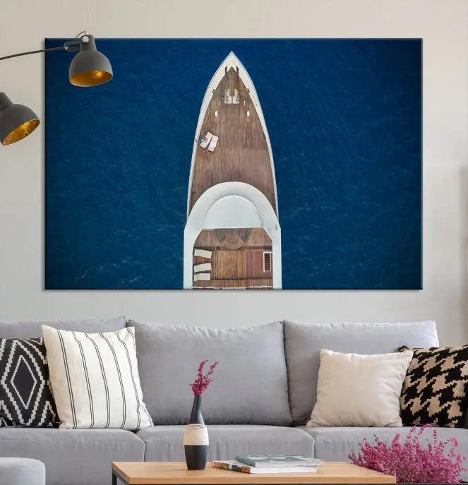 The Boat on the Sea Wall Art Canvas Print, depicting an aerial view of a yacht on ocean water, adds elegance to any room. This triptych is crafted on museum-quality canvas, ready to hang, and includes a UV-protective coating for enduring vibrancy.