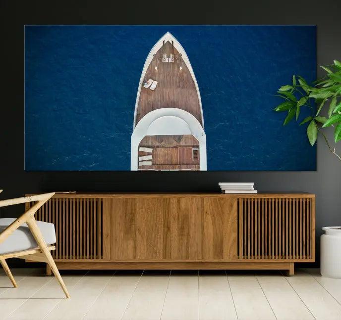 The Boat on the Sea Wall Art Canvas Print, depicting an aerial view of a yacht on ocean water, adds elegance to any room. This triptych is crafted on museum-quality canvas, ready to hang, and includes a UV-protective coating for enduring vibrancy.