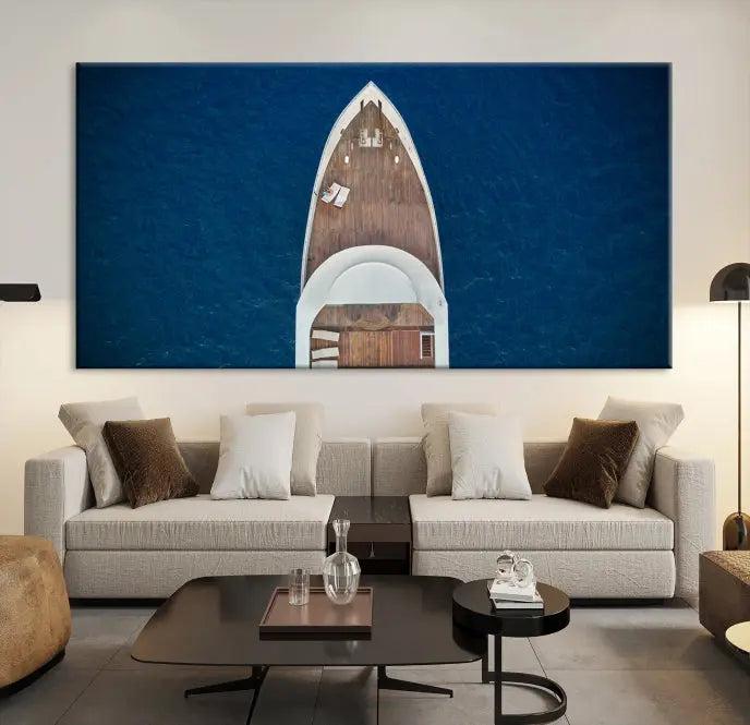 The Boat on the Sea Wall Art Canvas Print, depicting an aerial view of a yacht on ocean water, adds elegance to any room. This triptych is crafted on museum-quality canvas, ready to hang, and includes a UV-protective coating for enduring vibrancy.