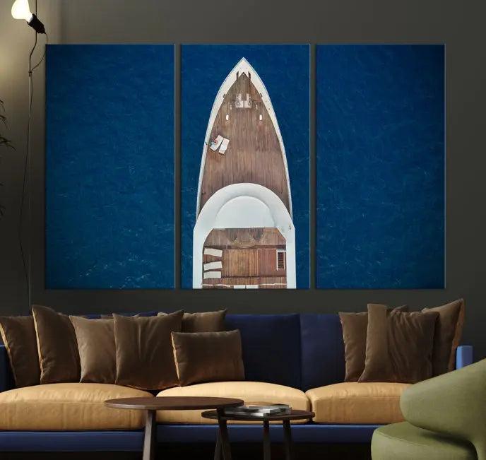 The Boat on the Sea Wall Art Canvas Print, depicting an aerial view of a yacht on ocean water, adds elegance to any room. This triptych is crafted on museum-quality canvas, ready to hang, and includes a UV-protective coating for enduring vibrancy.