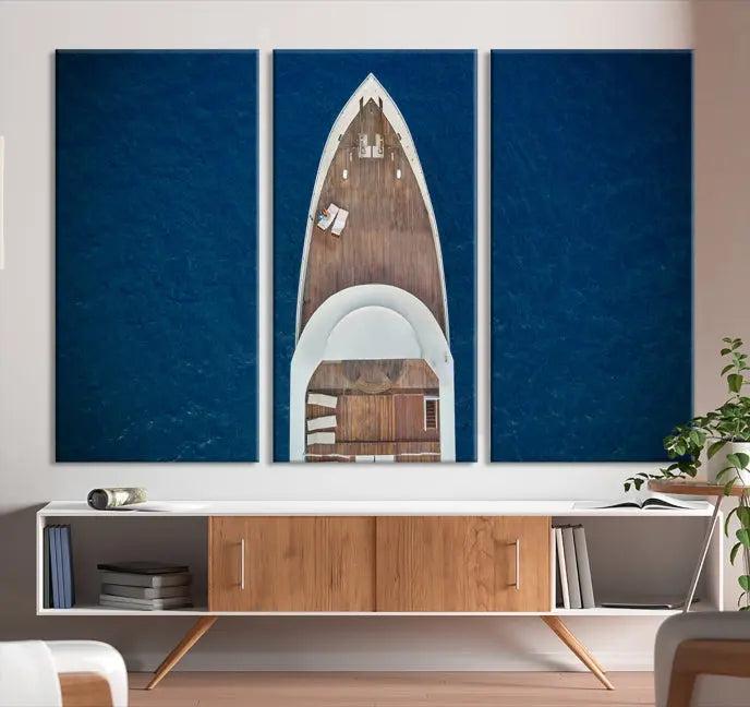 The Boat on the Sea Wall Art Canvas Print, depicting an aerial view of a yacht on ocean water, adds elegance to any room. This triptych is crafted on museum-quality canvas, ready to hang, and includes a UV-protective coating for enduring vibrancy.