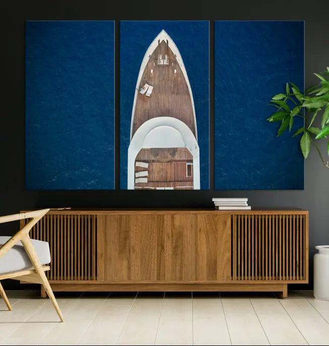 The Boat on the Sea Wall Art Canvas Print, depicting an aerial view of a yacht on ocean water, adds elegance to any room. This triptych is crafted on museum-quality canvas, ready to hang, and includes a UV-protective coating for enduring vibrancy.