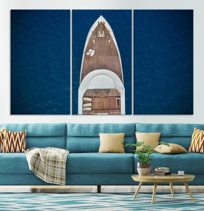 The Boat on the Sea Wall Art Canvas Print, depicting an aerial view of a yacht on ocean water, adds elegance to any room. This triptych is crafted on museum-quality canvas, ready to hang, and includes a UV-protective coating for enduring vibrancy.