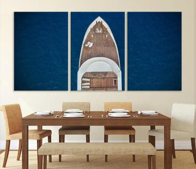 The Boat on the Sea Wall Art Canvas Print, depicting an aerial view of a yacht on ocean water, adds elegance to any room. This triptych is crafted on museum-quality canvas, ready to hang, and includes a UV-protective coating for enduring vibrancy.