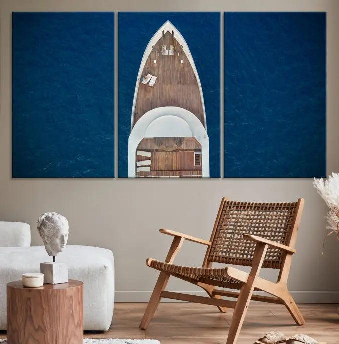 The Boat on the Sea Wall Art Canvas Print, depicting an aerial view of a yacht on ocean water, adds elegance to any room. This triptych is crafted on museum-quality canvas, ready to hang, and includes a UV-protective coating for enduring vibrancy.