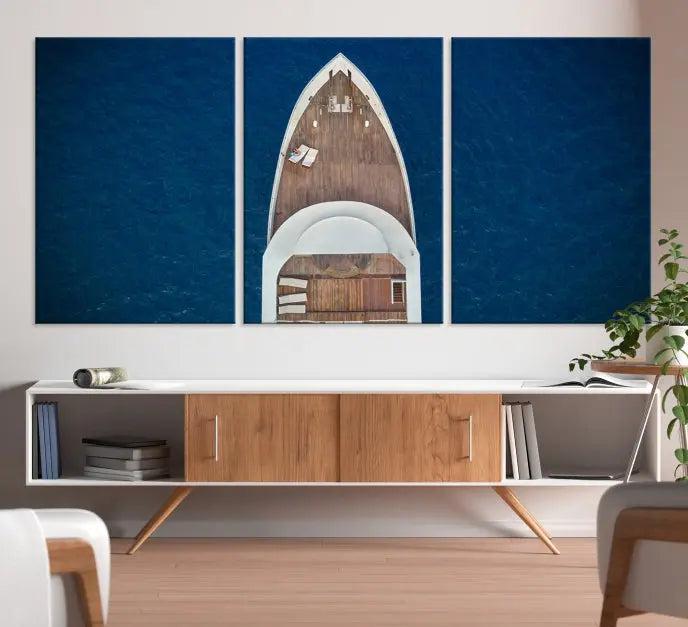 The Boat on the Sea Wall Art Canvas Print, depicting an aerial view of a yacht on ocean water, adds elegance to any room. This triptych is crafted on museum-quality canvas, ready to hang, and includes a UV-protective coating for enduring vibrancy.