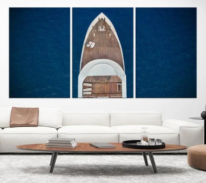 The Boat on the Sea Wall Art Canvas Print, depicting an aerial view of a yacht on ocean water, adds elegance to any room. This triptych is crafted on museum-quality canvas, ready to hang, and includes a UV-protective coating for enduring vibrancy.