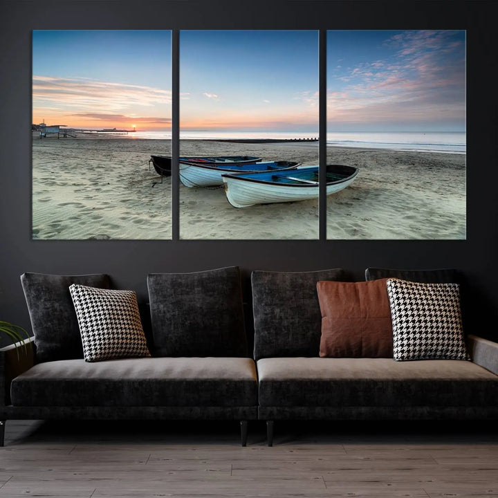 The "Boats On The Beach Wall Art Canvas Print," featuring a triptych photo of boats at sunset, is printed on museum-quality canvas with a UV-protective coating.