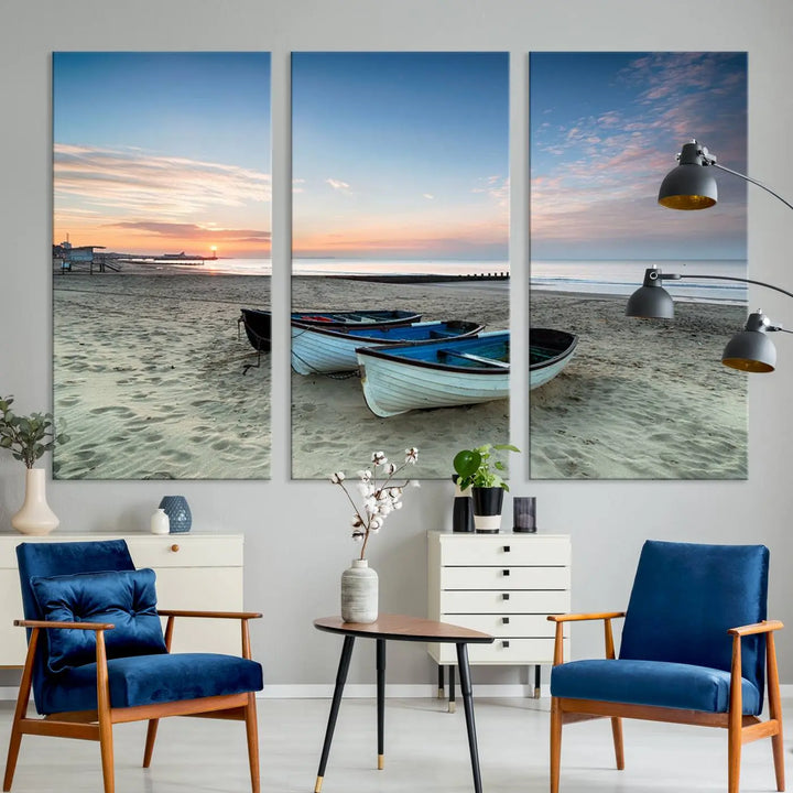 The "Boats On The Beach Wall Art Canvas Print," featuring a triptych photo of boats at sunset, is printed on museum-quality canvas with a UV-protective coating.