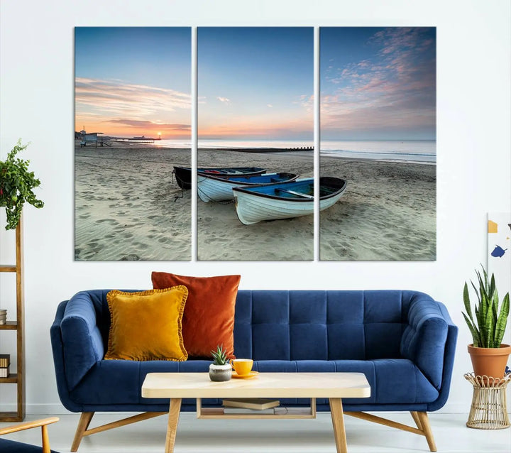 The "Boats On The Beach Wall Art Canvas Print," featuring a triptych photo of boats at sunset, is printed on museum-quality canvas with a UV-protective coating.