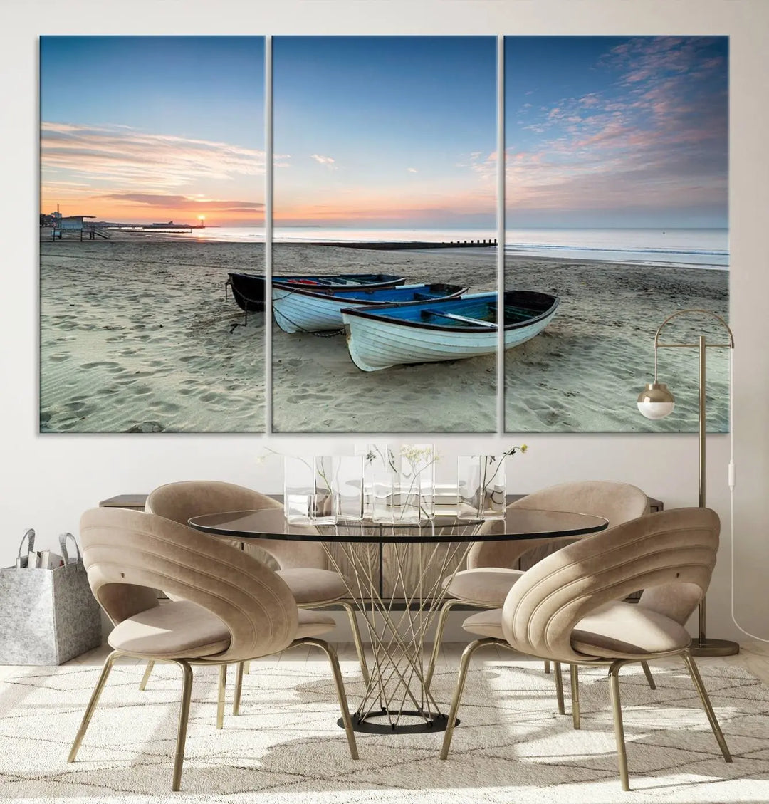 The "Boats On The Beach Wall Art Canvas Print," featuring a triptych photo of boats at sunset, is printed on museum-quality canvas with a UV-protective coating.