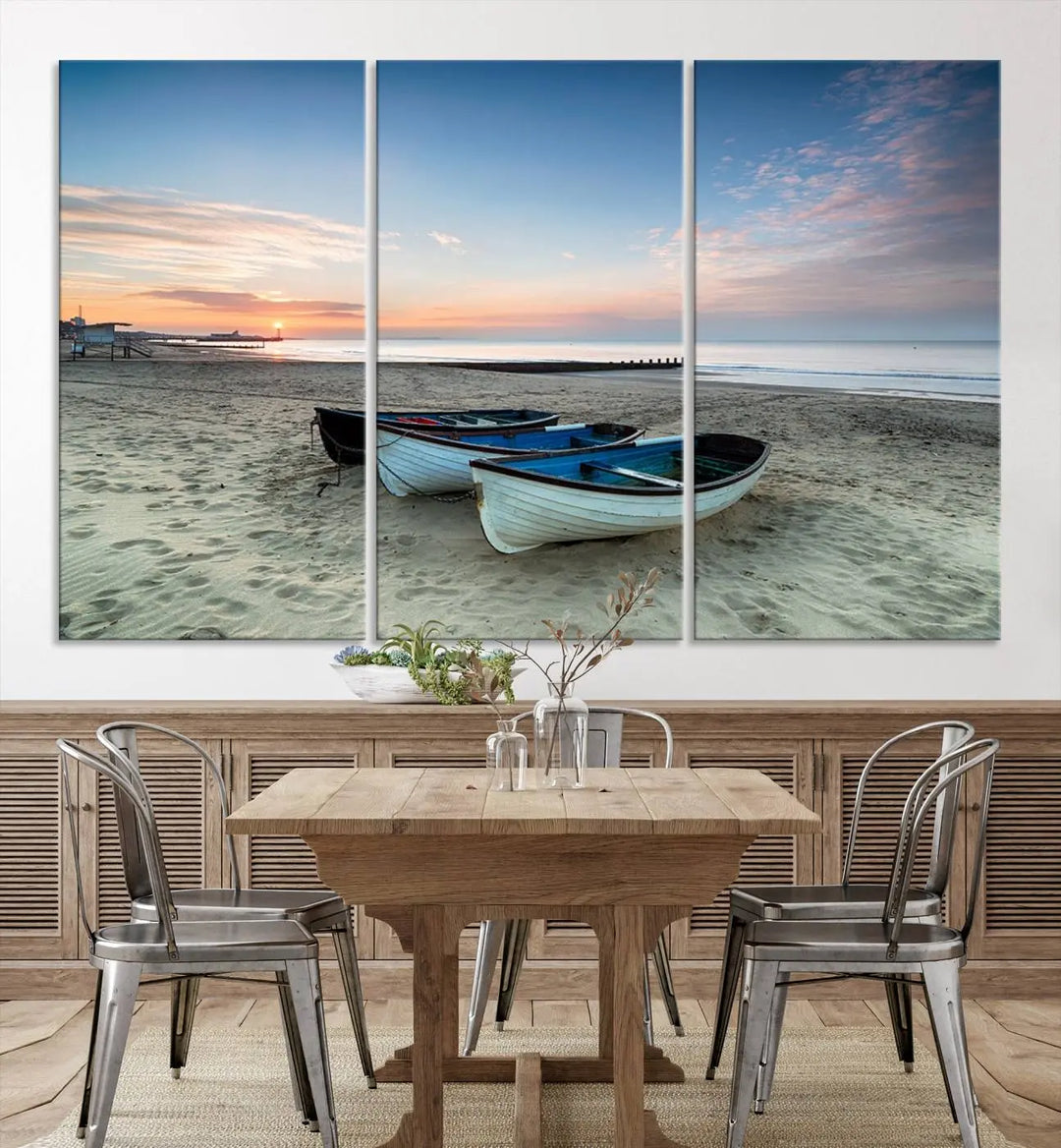 The "Boats On The Beach Wall Art Canvas Print," featuring a triptych photo of boats at sunset, is printed on museum-quality canvas with a UV-protective coating.