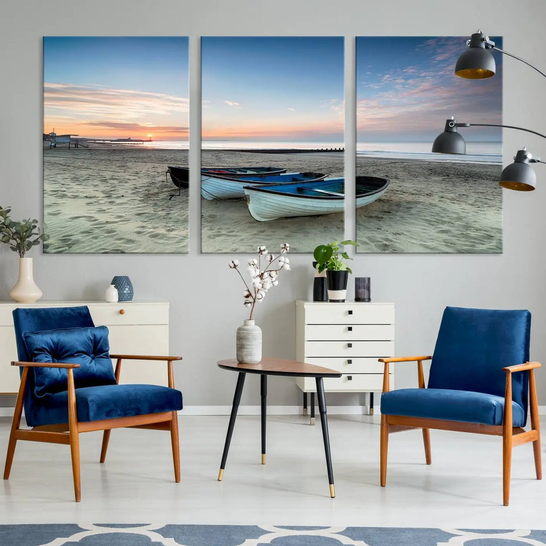 The "Boats On The Beach Wall Art Canvas Print," featuring a triptych photo of boats at sunset, is printed on museum-quality canvas with a UV-protective coating.