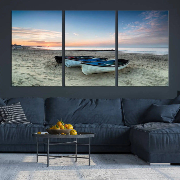 The "Boats On The Beach Wall Art Canvas Print," featuring a triptych photo of boats at sunset, is printed on museum-quality canvas with a UV-protective coating.