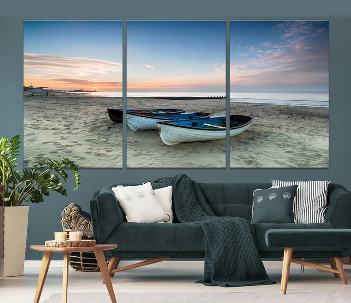 The "Boats On The Beach Wall Art Canvas Print," featuring a triptych photo of boats at sunset, is printed on museum-quality canvas with a UV-protective coating.