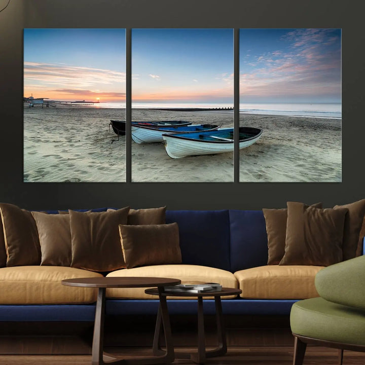 The "Boats On The Beach Wall Art Canvas Print," featuring a triptych photo of boats at sunset, is printed on museum-quality canvas with a UV-protective coating.