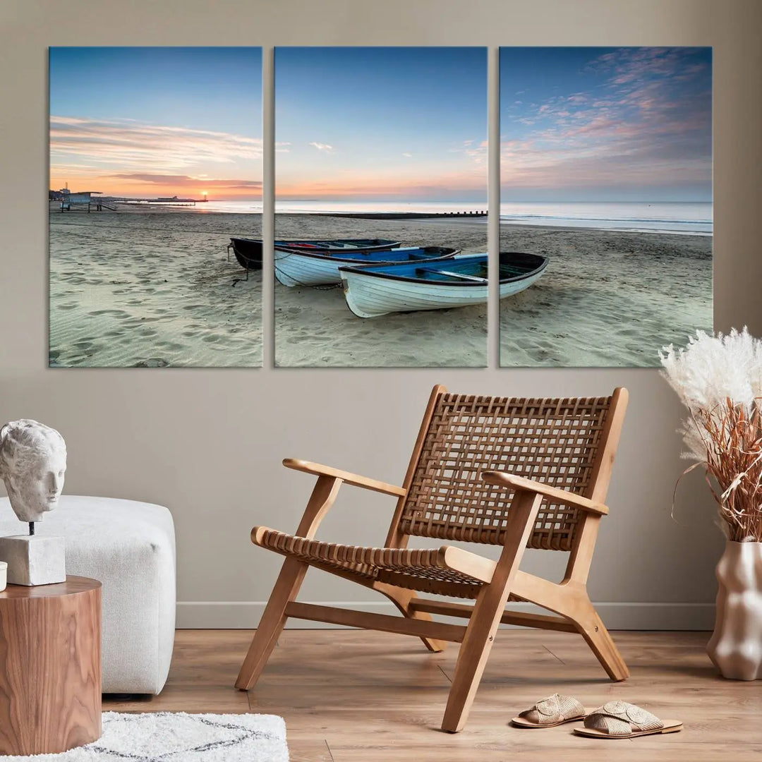 The "Boats On The Beach Wall Art Canvas Print," featuring a triptych photo of boats at sunset, is printed on museum-quality canvas with a UV-protective coating.