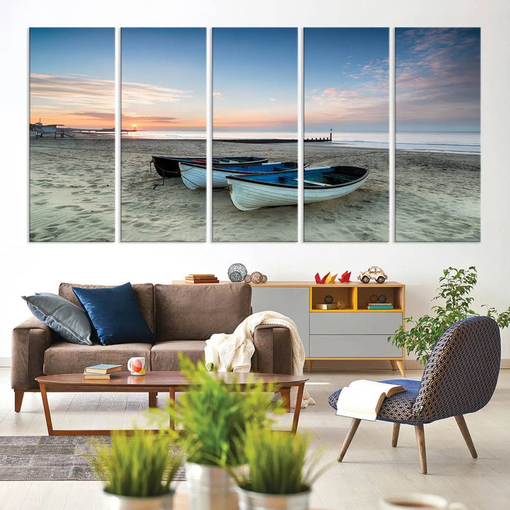 The "Boats On The Beach Wall Art Canvas Print," featuring a triptych photo of boats at sunset, is printed on museum-quality canvas with a UV-protective coating.