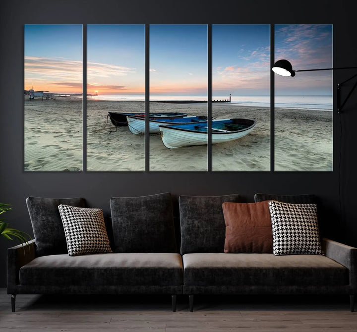 The "Boats On The Beach Wall Art Canvas Print," featuring a triptych photo of boats at sunset, is printed on museum-quality canvas with a UV-protective coating.