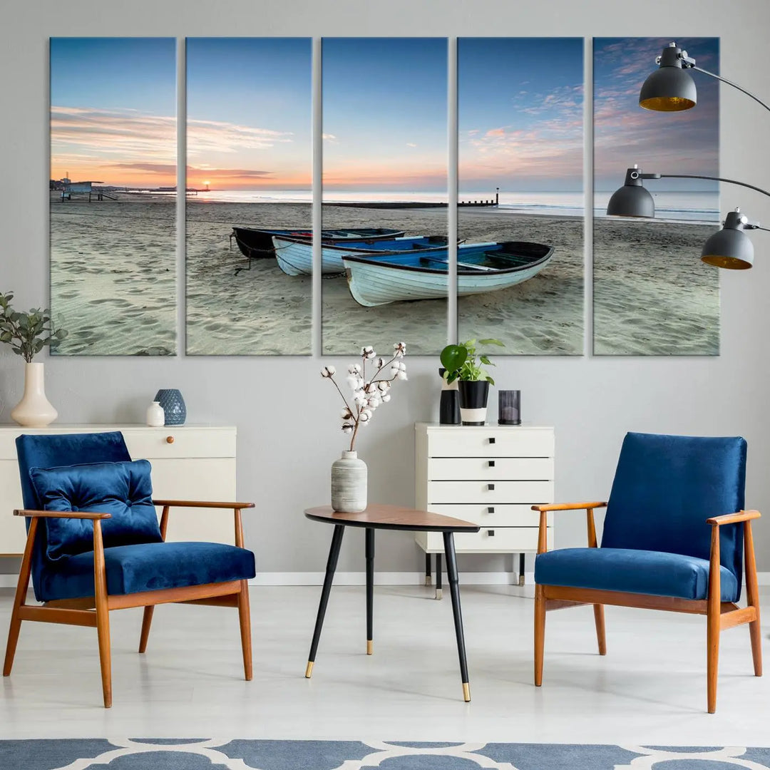 The "Boats On The Beach Wall Art Canvas Print," featuring a triptych photo of boats at sunset, is printed on museum-quality canvas with a UV-protective coating.