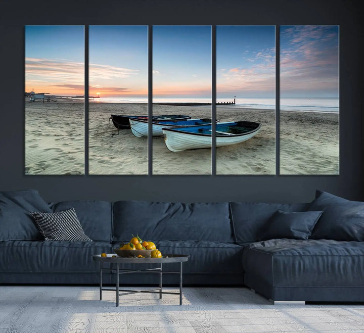 The "Boats On The Beach Wall Art Canvas Print," featuring a triptych photo of boats at sunset, is printed on museum-quality canvas with a UV-protective coating.