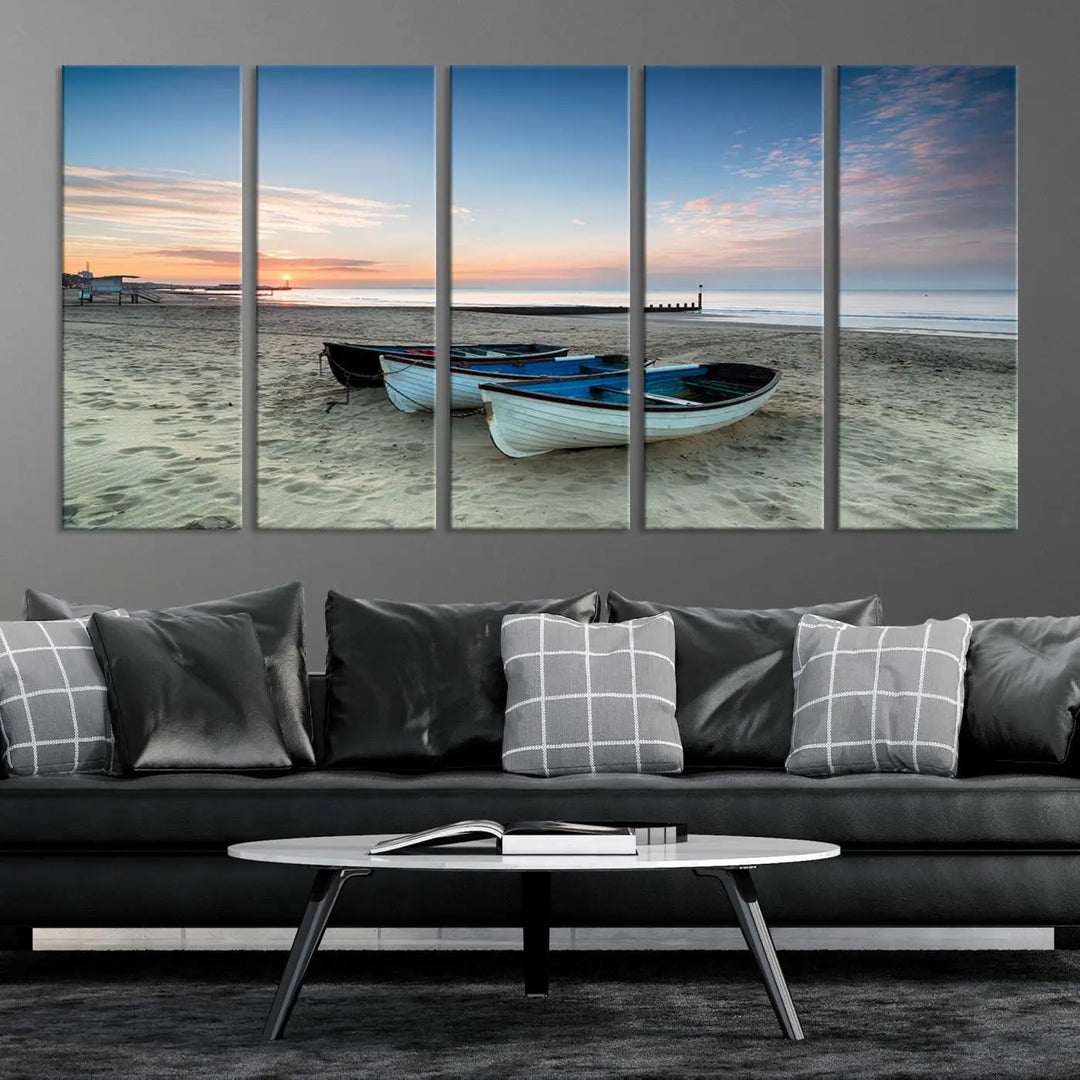 The "Boats On The Beach Wall Art Canvas Print," featuring a triptych photo of boats at sunset, is printed on museum-quality canvas with a UV-protective coating.