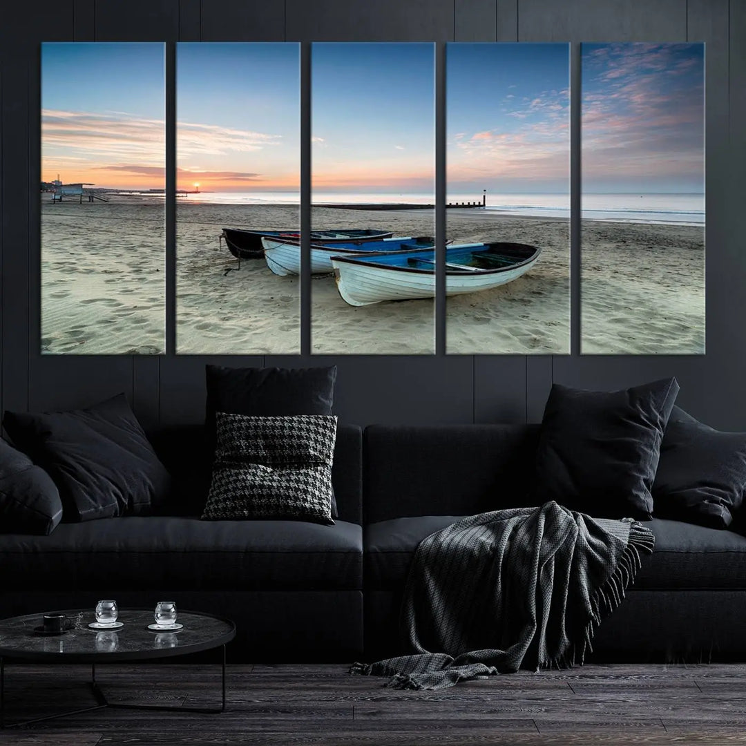 The "Boats On The Beach Wall Art Canvas Print," featuring a triptych photo of boats at sunset, is printed on museum-quality canvas with a UV-protective coating.