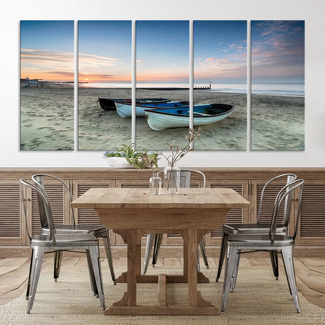 The "Boats On The Beach Wall Art Canvas Print," featuring a triptych photo of boats at sunset, is printed on museum-quality canvas with a UV-protective coating.