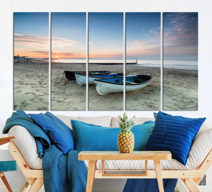 The "Boats On The Beach Wall Art Canvas Print," featuring a triptych photo of boats at sunset, is printed on museum-quality canvas with a UV-protective coating.