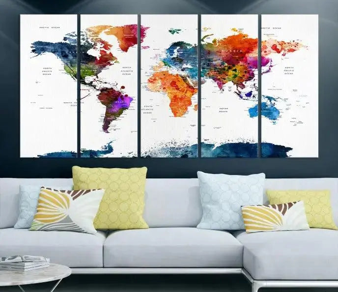 A bold and colorful world map from the "Bold & Colorful World Map Multi-Panel Framed Canvas Print" collection adorns three panels in a modern room. This ready-to-hang art piece infuses vibrant charm into any space.