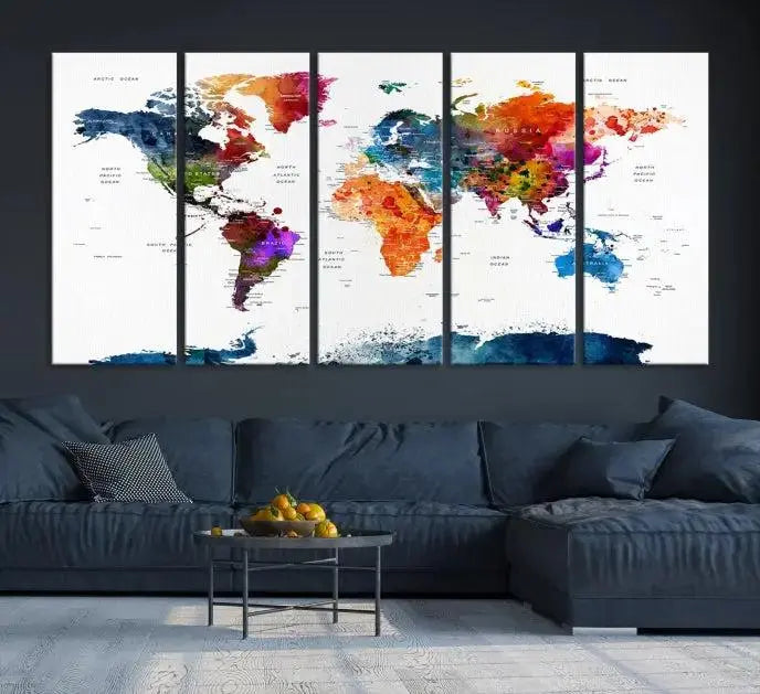A bold and colorful world map from the "Bold & Colorful World Map Multi-Panel Framed Canvas Print" collection adorns three panels in a modern room. This ready-to-hang art piece infuses vibrant charm into any space.