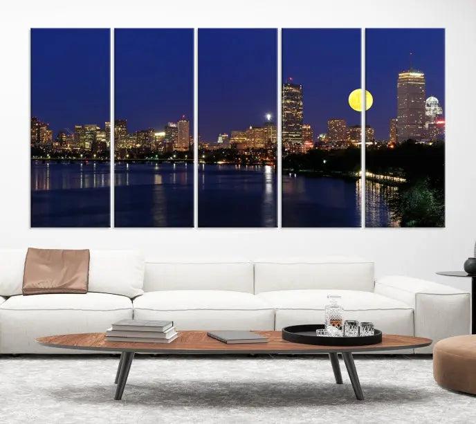 The "Boston City Lights Full Moon Night Skyline Cityscape View Wall Art Canvas Print" is a captivating triptych featuring a city skyline at night with a large moon. Crafted on museum-quality canvases, each piece is ready to hang and includes UV-protective coating to preserve its vibrant allure.