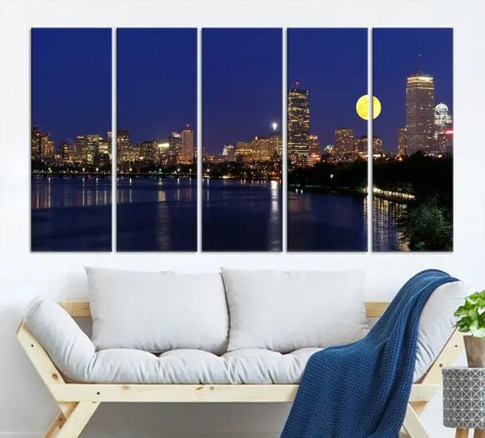 The "Boston City Lights Full Moon Night Skyline Cityscape View Wall Art Canvas Print" is a captivating triptych featuring a city skyline at night with a large moon. Crafted on museum-quality canvases, each piece is ready to hang and includes UV-protective coating to preserve its vibrant allure.