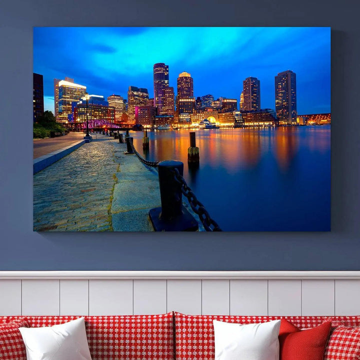 The "Boston City Lights Night Blue Skyline Cityscape" is a stunning large wall art of a city skyline at dusk, printed on museum-quality canvas with a UV-protective coating. It is ready to hang and can instantly transform your space.