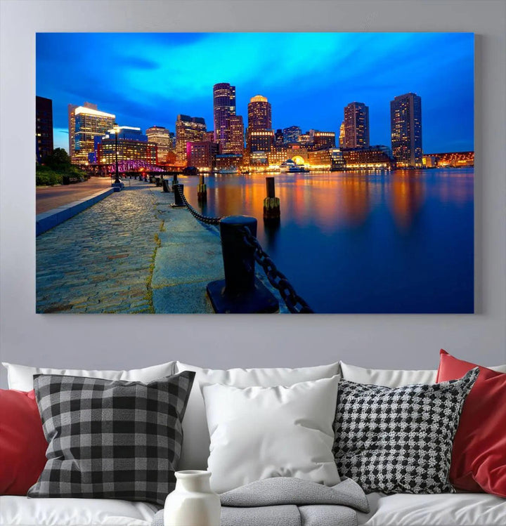 The "Boston City Lights Night Blue Skyline Cityscape" is a stunning large wall art of a city skyline at dusk, printed on museum-quality canvas with a UV-protective coating. It is ready to hang and can instantly transform your space.