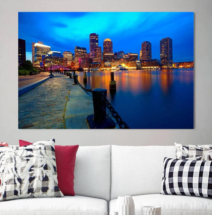 The "Boston City Lights Night Blue Skyline Cityscape" is a stunning large wall art of a city skyline at dusk, printed on museum-quality canvas with a UV-protective coating. It is ready to hang and can instantly transform your space.