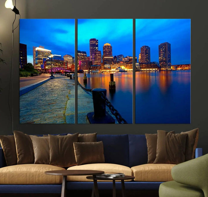 The "Boston City Lights Night Blue Skyline Cityscape" is a stunning large wall art of a city skyline at dusk, printed on museum-quality canvas with a UV-protective coating. It is ready to hang and can instantly transform your space.