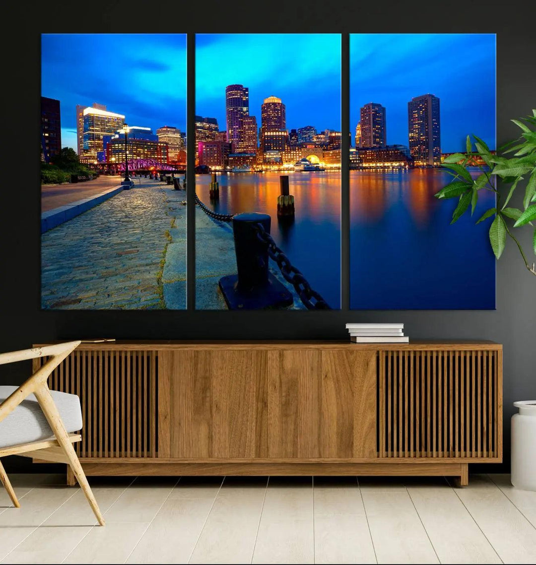 The "Boston City Lights Night Blue Skyline Cityscape" is a stunning large wall art of a city skyline at dusk, printed on museum-quality canvas with a UV-protective coating. It is ready to hang and can instantly transform your space.