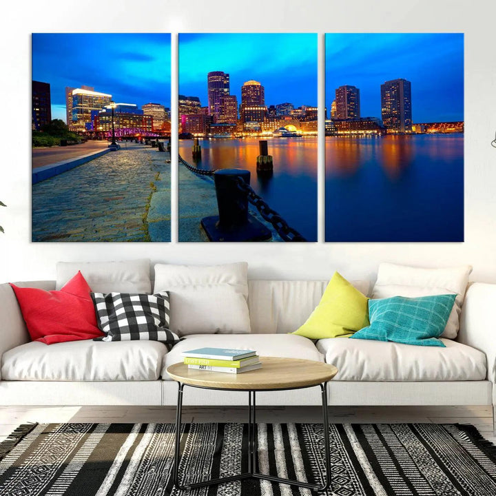 The "Boston City Lights Night Blue Skyline Cityscape" is a stunning large wall art of a city skyline at dusk, printed on museum-quality canvas with a UV-protective coating. It is ready to hang and can instantly transform your space.