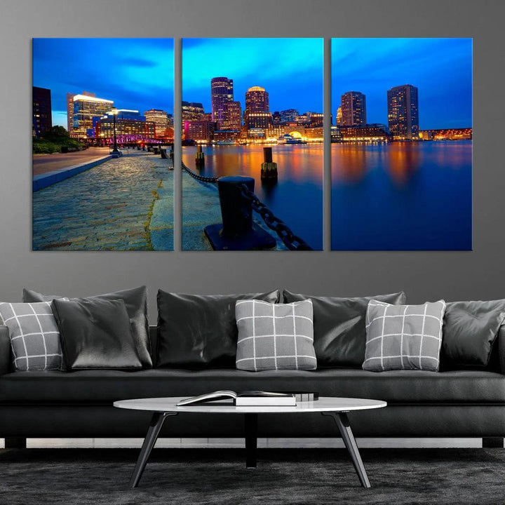 The "Boston City Lights Night Blue Skyline Cityscape" is a stunning large wall art of a city skyline at dusk, printed on museum-quality canvas with a UV-protective coating. It is ready to hang and can instantly transform your space.