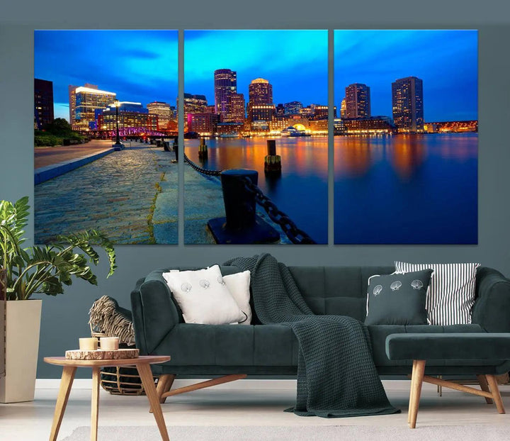 The "Boston City Lights Night Blue Skyline Cityscape" is a stunning large wall art of a city skyline at dusk, printed on museum-quality canvas with a UV-protective coating. It is ready to hang and can instantly transform your space.