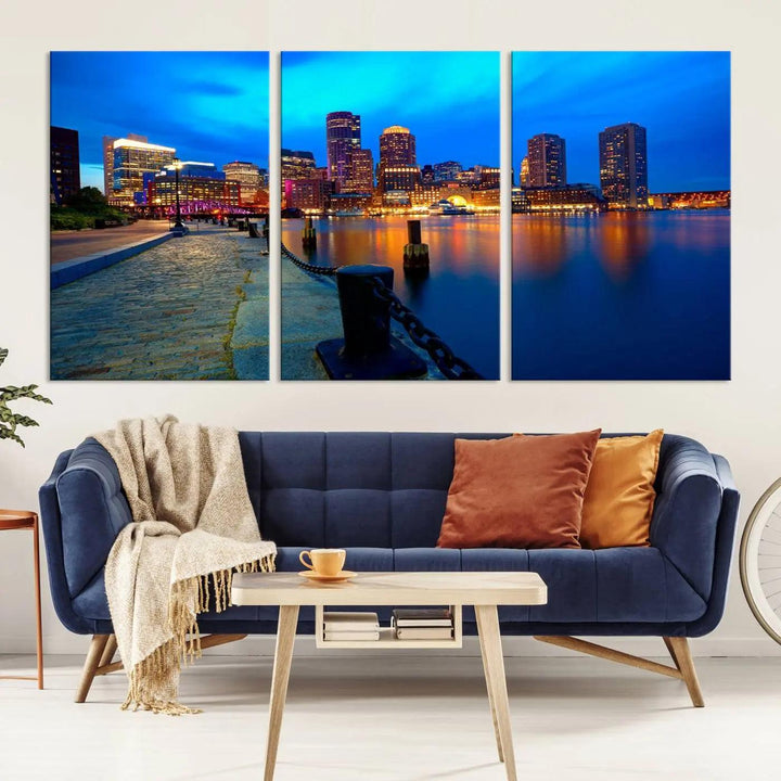 The "Boston City Lights Night Blue Skyline Cityscape" is a stunning large wall art of a city skyline at dusk, printed on museum-quality canvas with a UV-protective coating. It is ready to hang and can instantly transform your space.