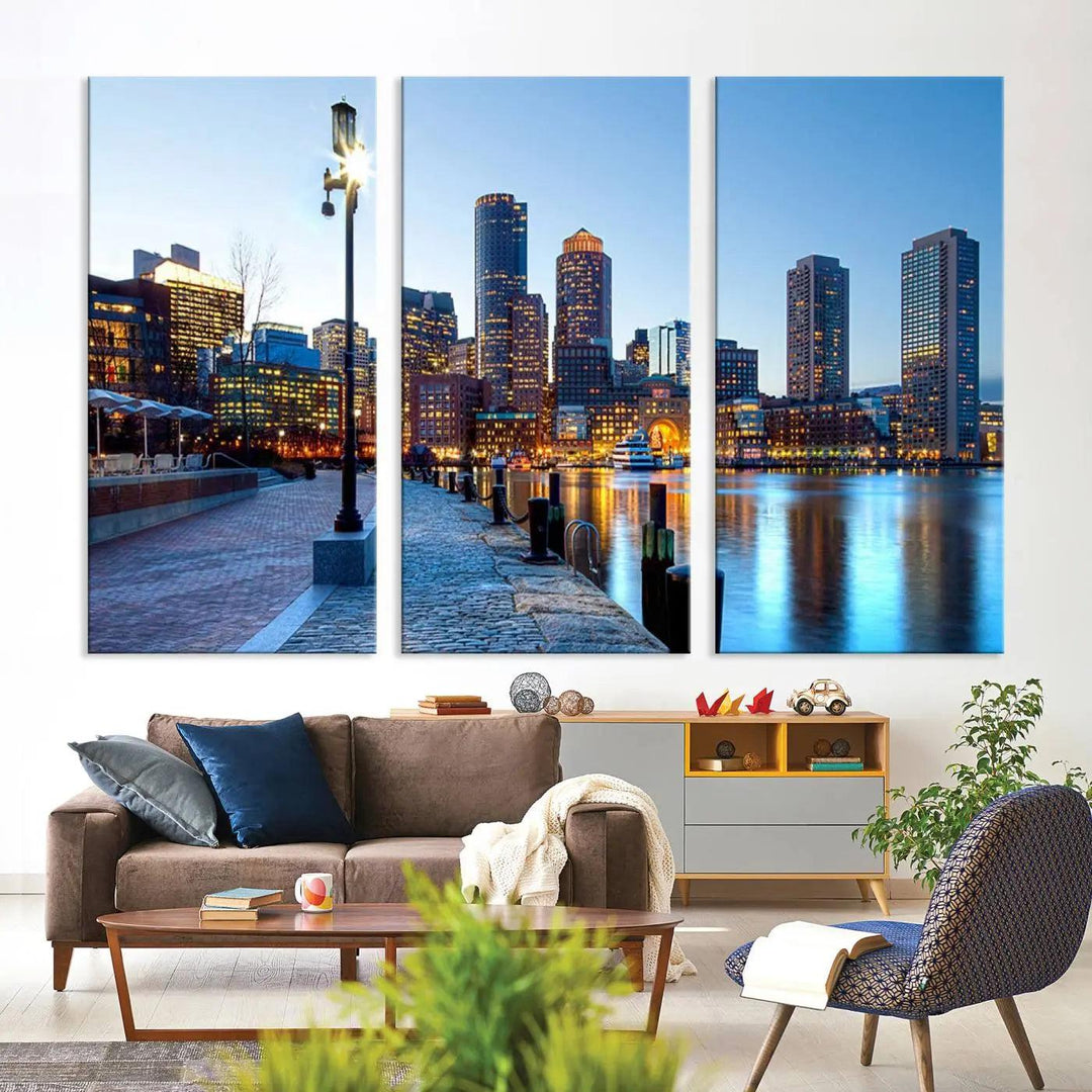 The modern living room features the Boston City Lights Sunrise Skyline Cityscape View Wall Art Canvas Print, crafted with museum-quality canvas and a UV-protective coating.